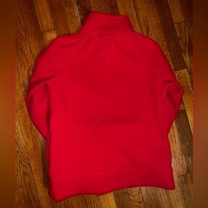 Red Tommy fleece unisex jacket. Very good condition. Zip up. Warm and cozy.